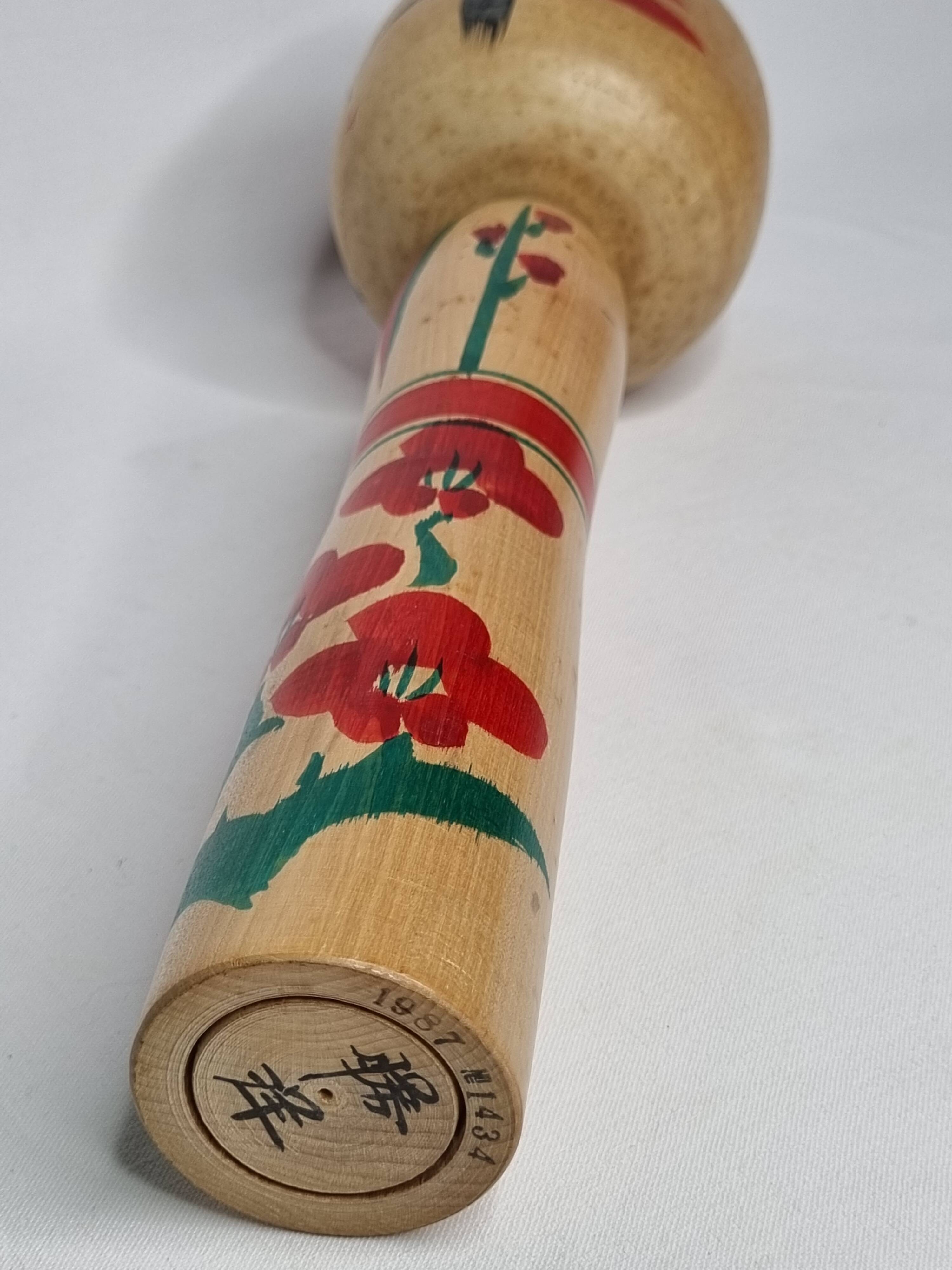 Vintage Japanese Kokeshi doll dated 1987, signed and numbered, floral decoration, 36 cm