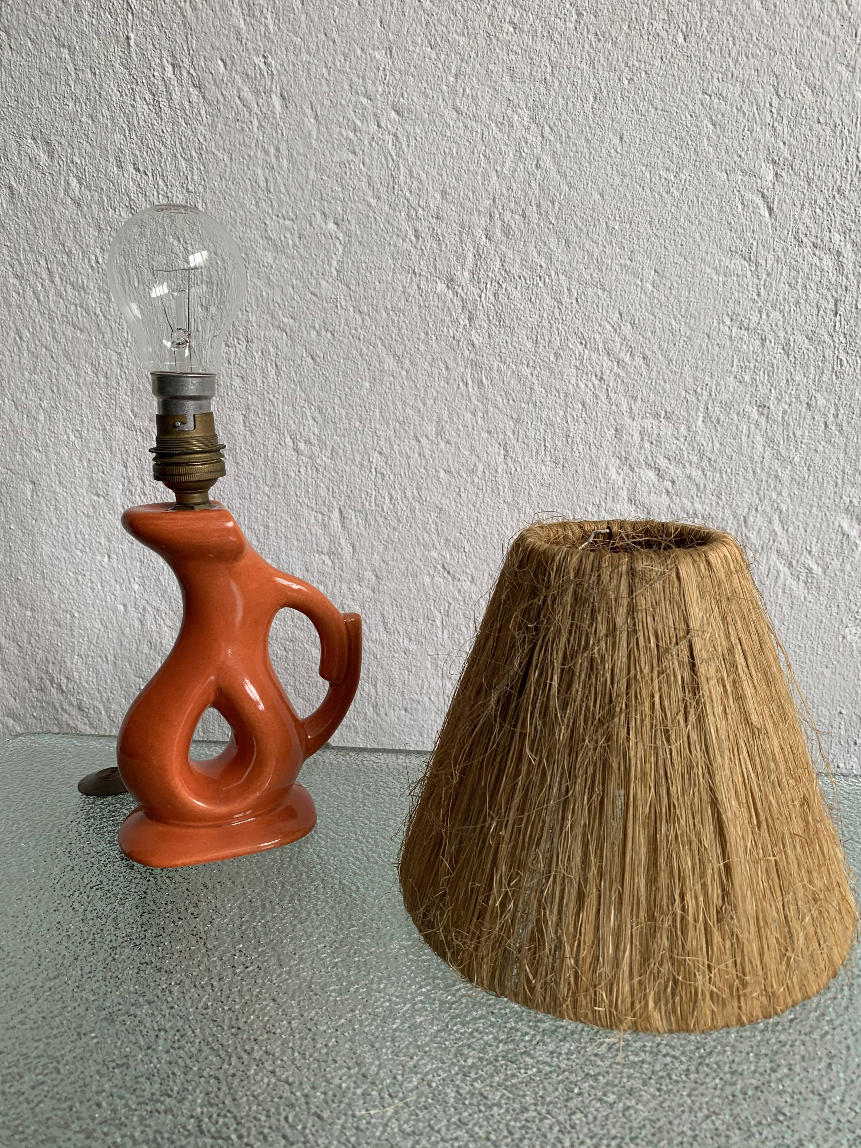 Vintage ceramic and raffia lamp