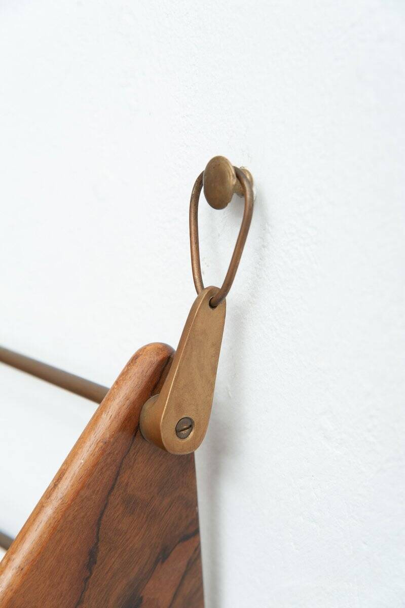 Wall-mounted walnut bookshelf by Carl Auböck, 1950s