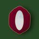Oval wall mirror in burgundy velvet and brass – 1950s–1960s
