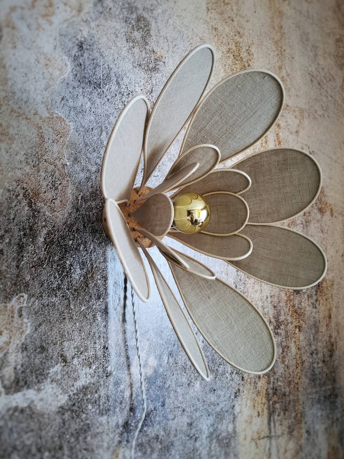 Flower wall light made of rattan and natural linen petals