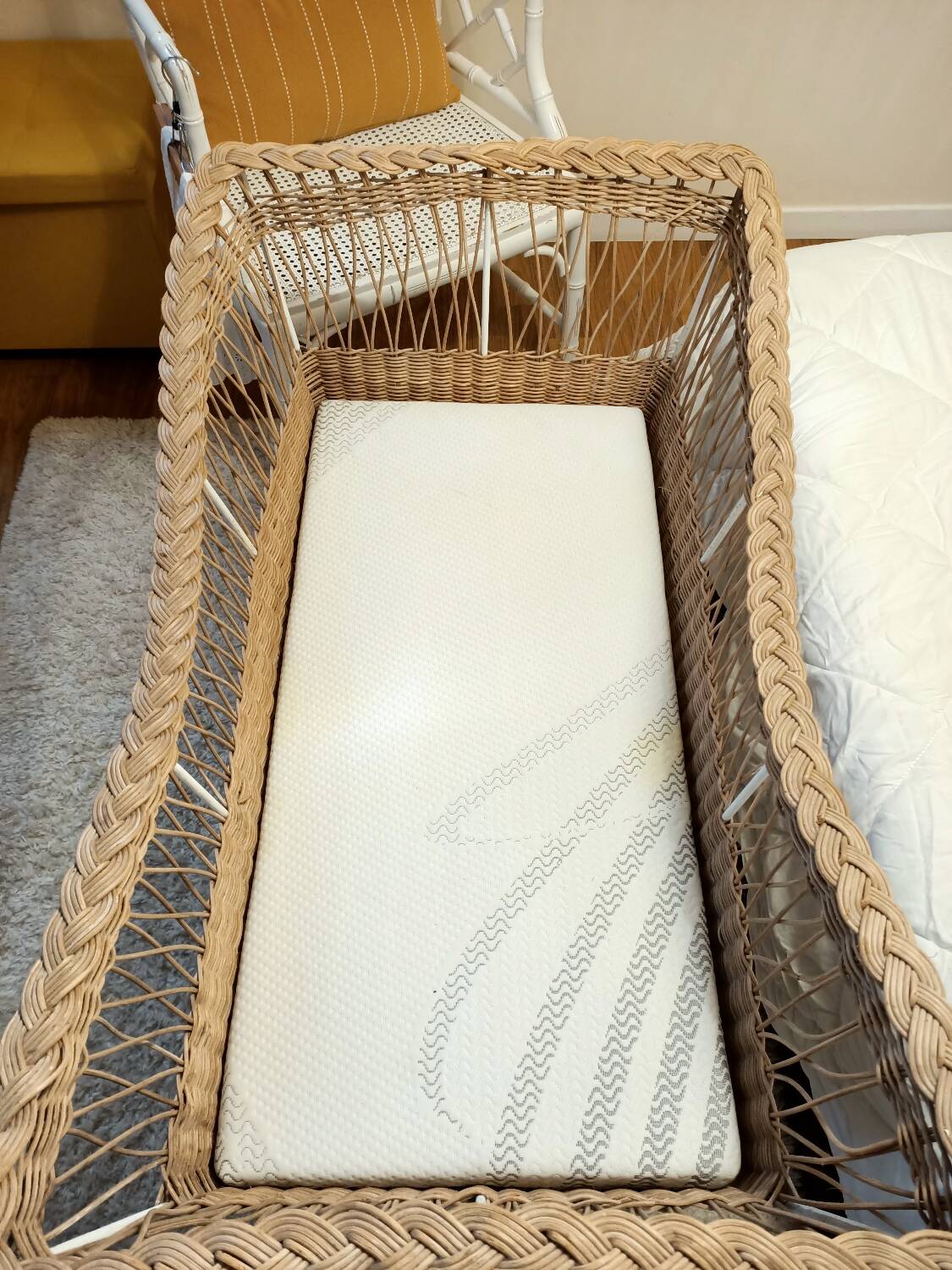 Rattan and wrought iron cradle