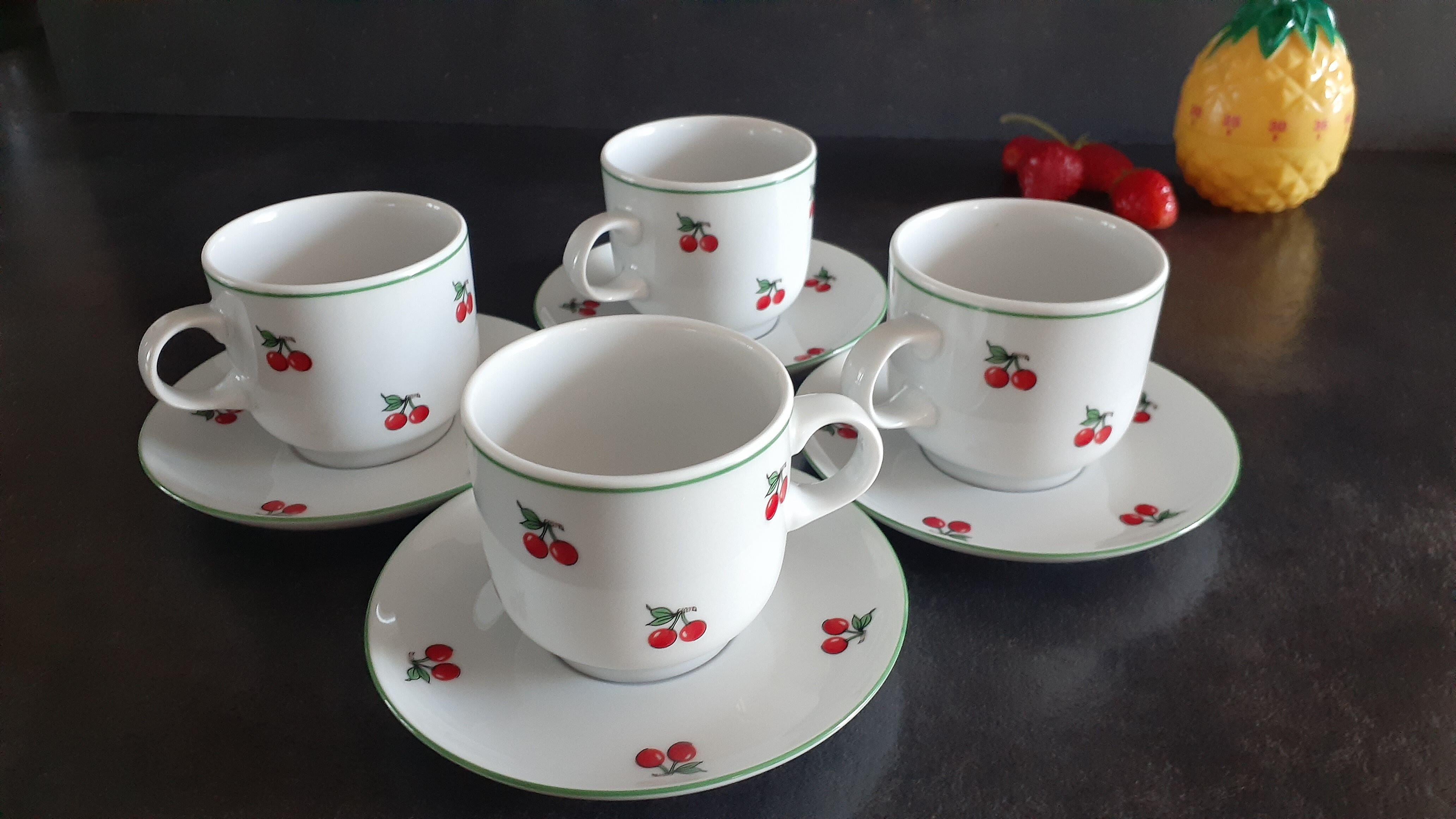 4 coffee cups with cherry motifs