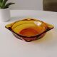 Vintage amber Duralex ashtray from the 1970s.