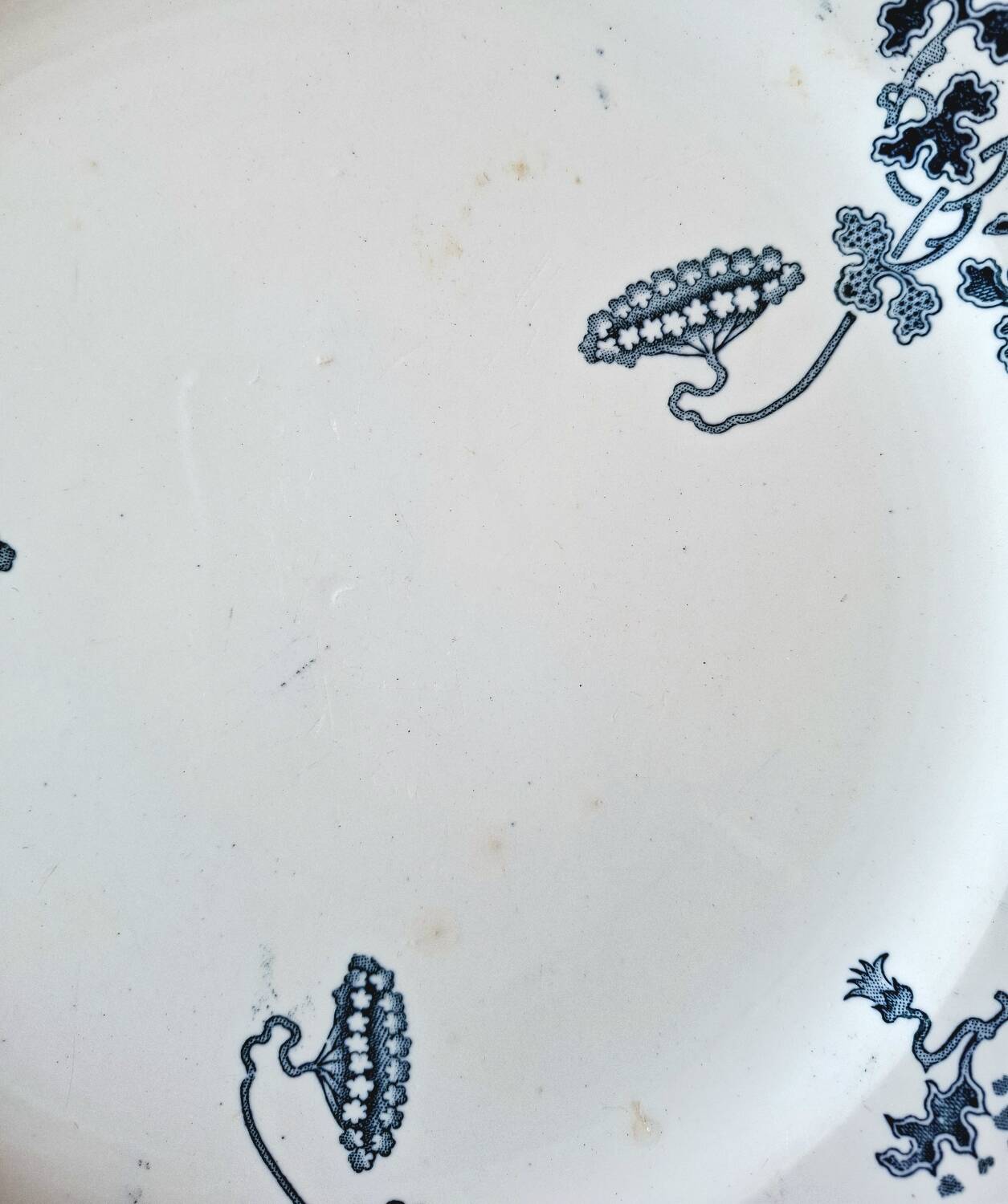 Antique earthenware dessert plates accompanied by a dish