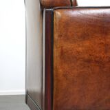 Sheepskin Art Deco design armchair with wood and beautiful cognac-colored leather