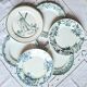 Old mismatched flat plates made of ironstone earthenware.
