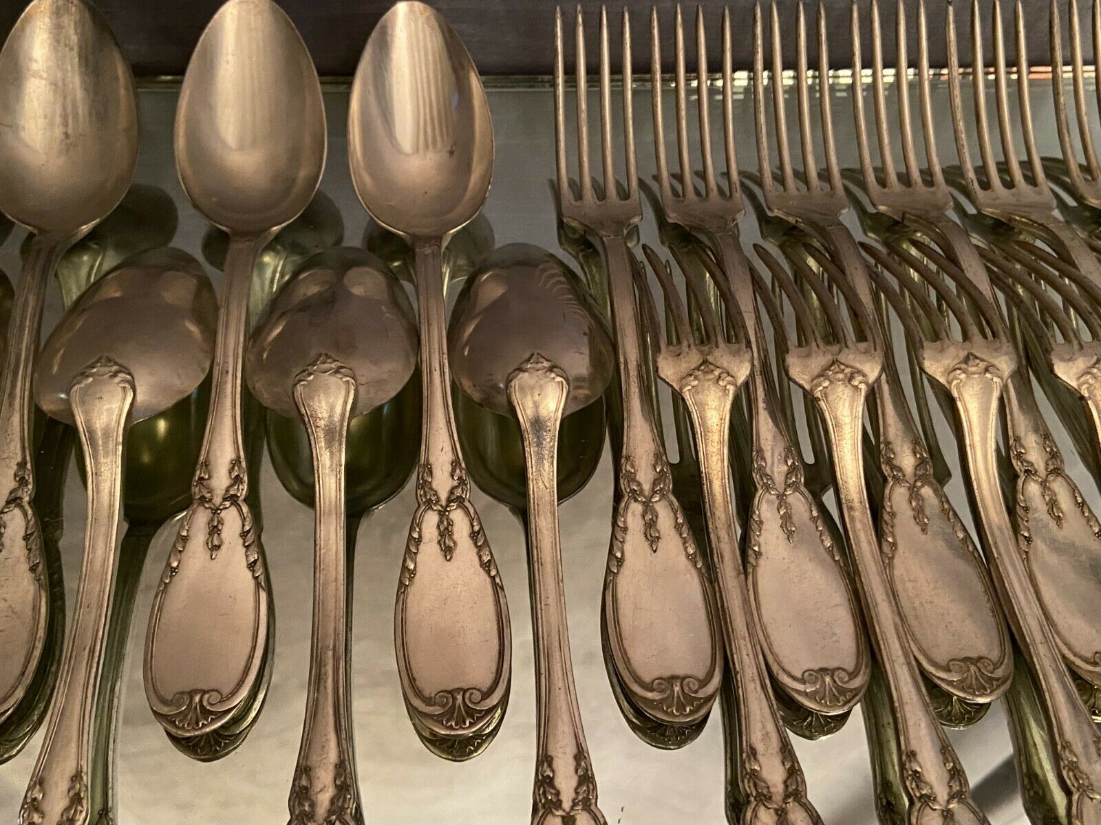 12 forks and 12 spoons in Louis XVI style metal
