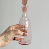 Antique translucent pink glass bottle