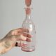 Antique translucent pink glass bottle