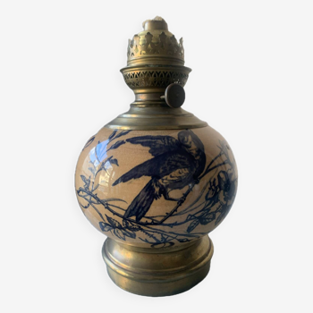 Old kerosene lamp with blue bird decor