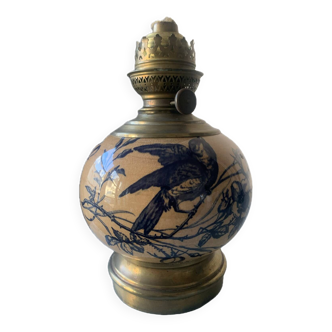 Old kerosene lamp with blue bird decor