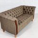 Chesterfield sofa in leather, fabric and wood