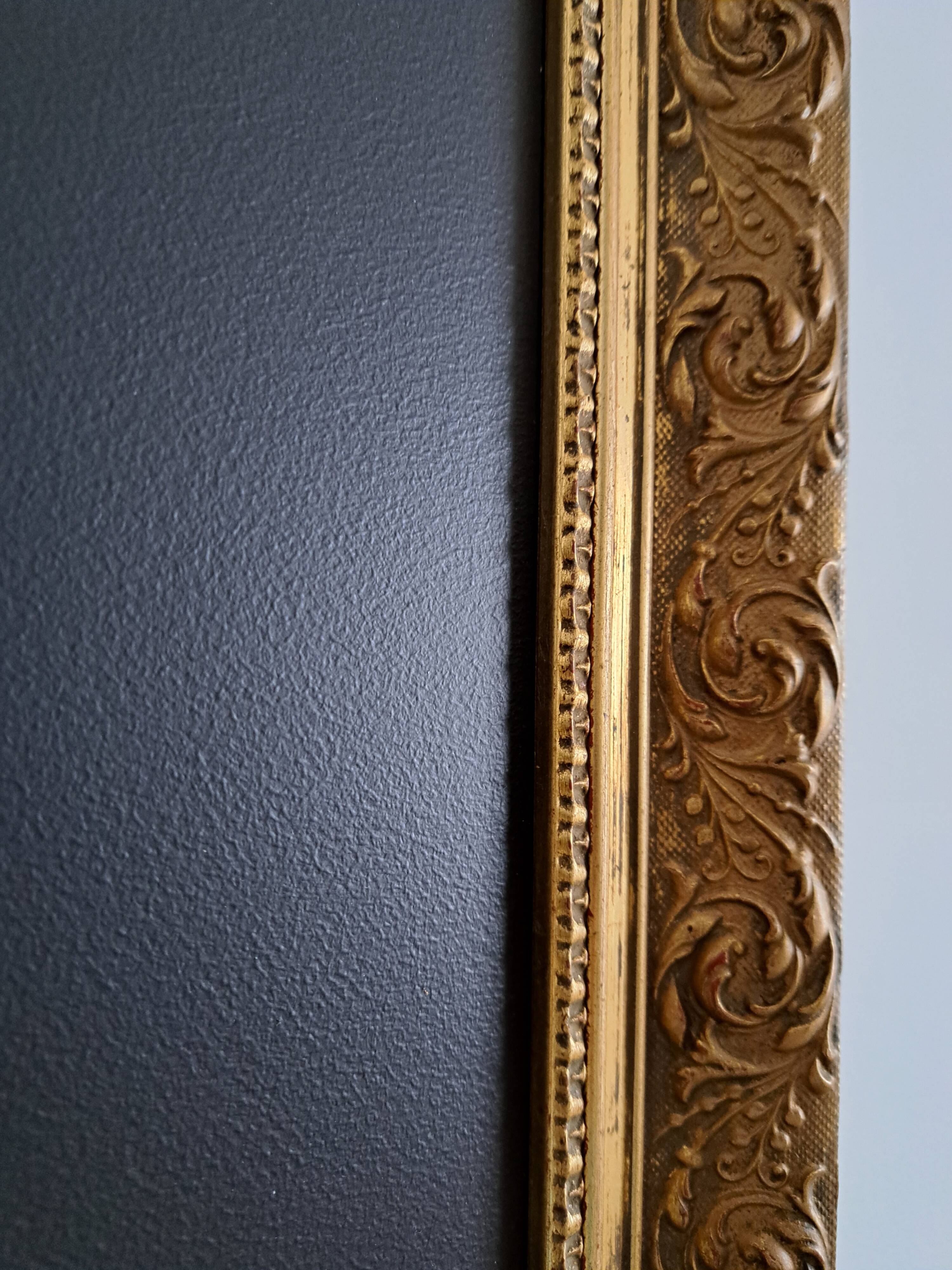 Slate table framed in gold leaf style