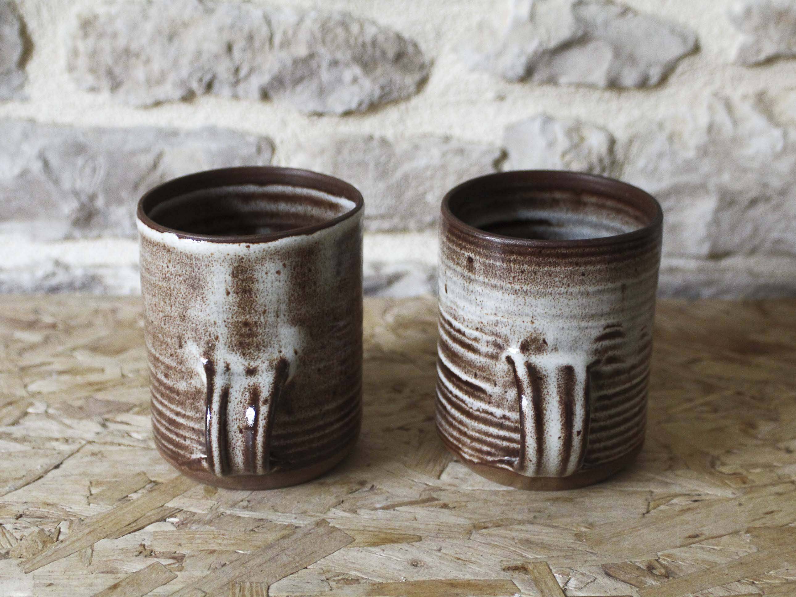 Pair of Roger Jacques Puisaye enameled stoneware cups