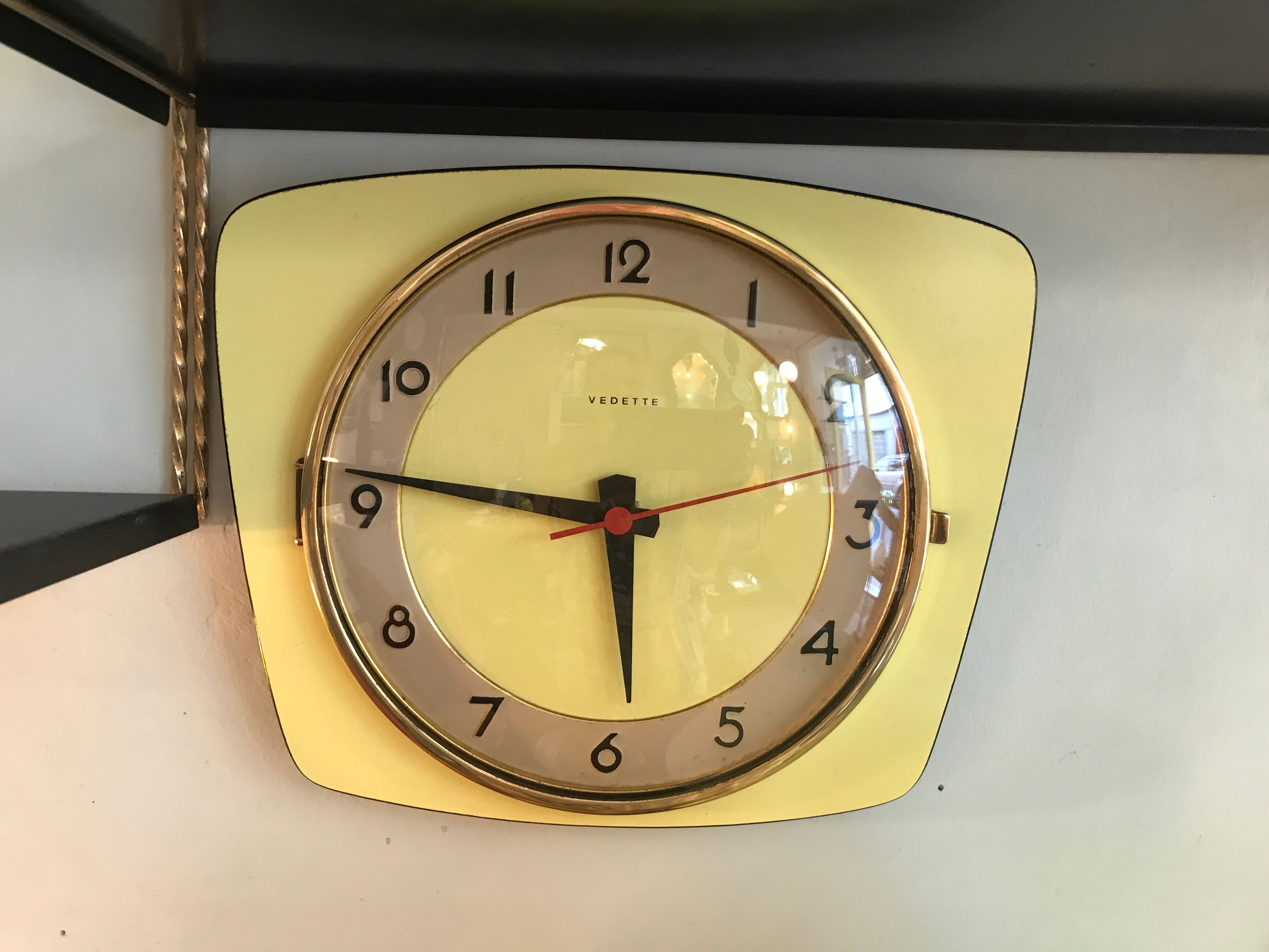 Vintage clock star Formica yellow wall pendulum