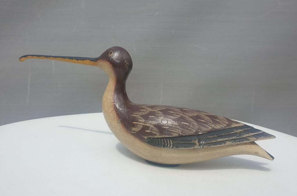 Carved painted wooden curlew