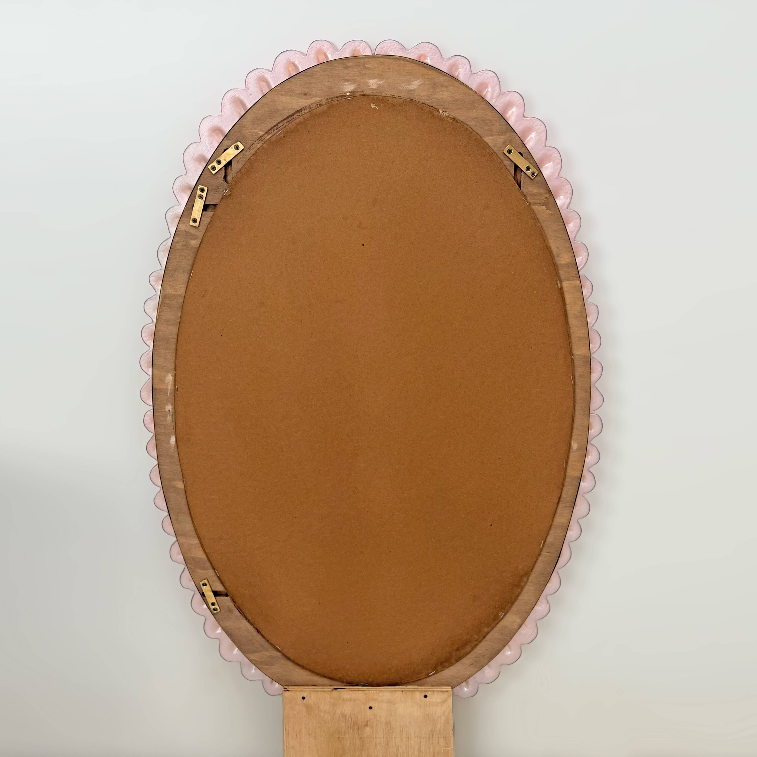 Italian oval mirror in brass and pink blown Murano glass