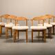Henning Kjærnulf dining chairs set in Oak and Sheepskin, Denmark, 1960s