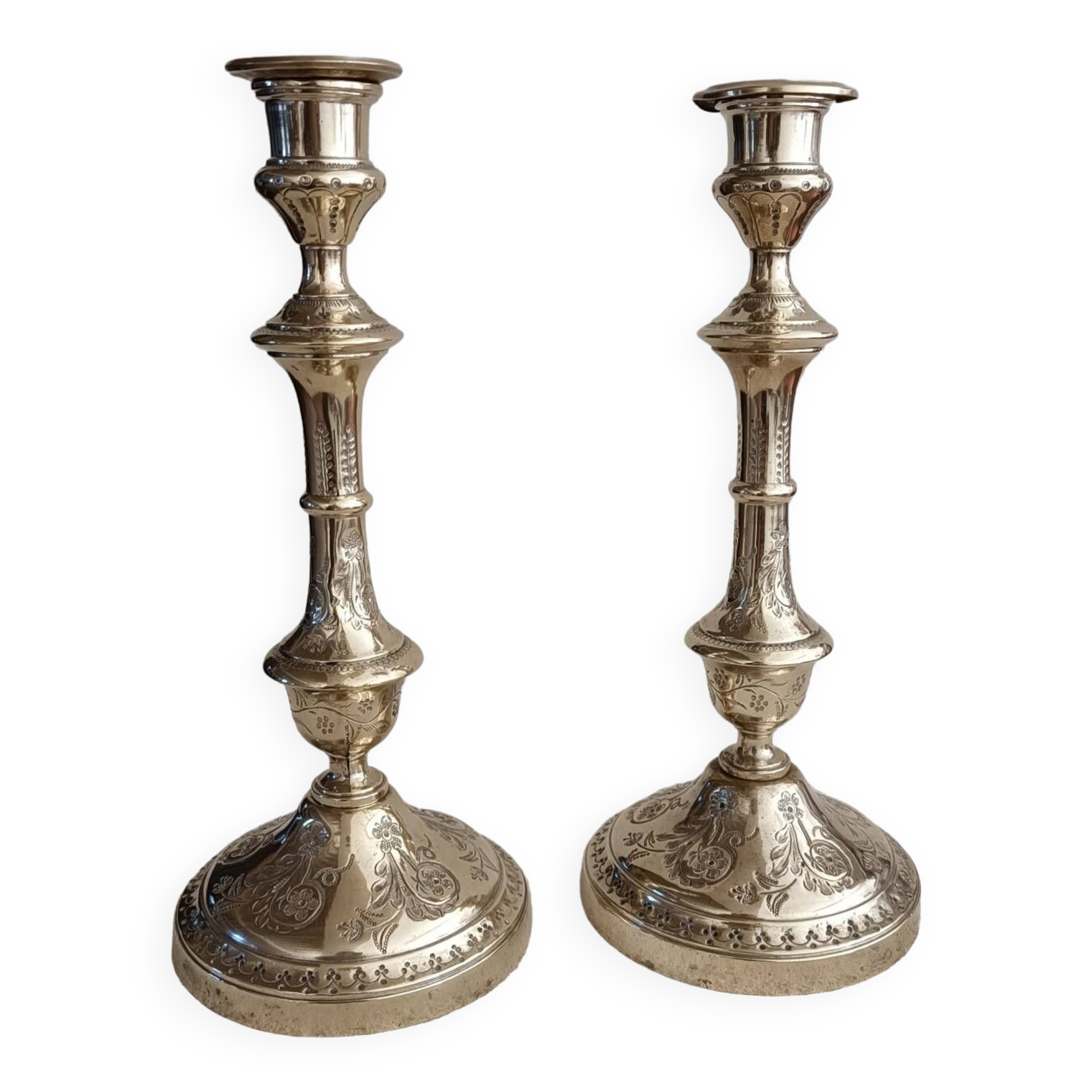 Pair of chiseled brass candlesticks