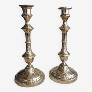 Pair of chiseled brass torch candlesticks