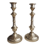 Pair of chiseled brass candlesticks