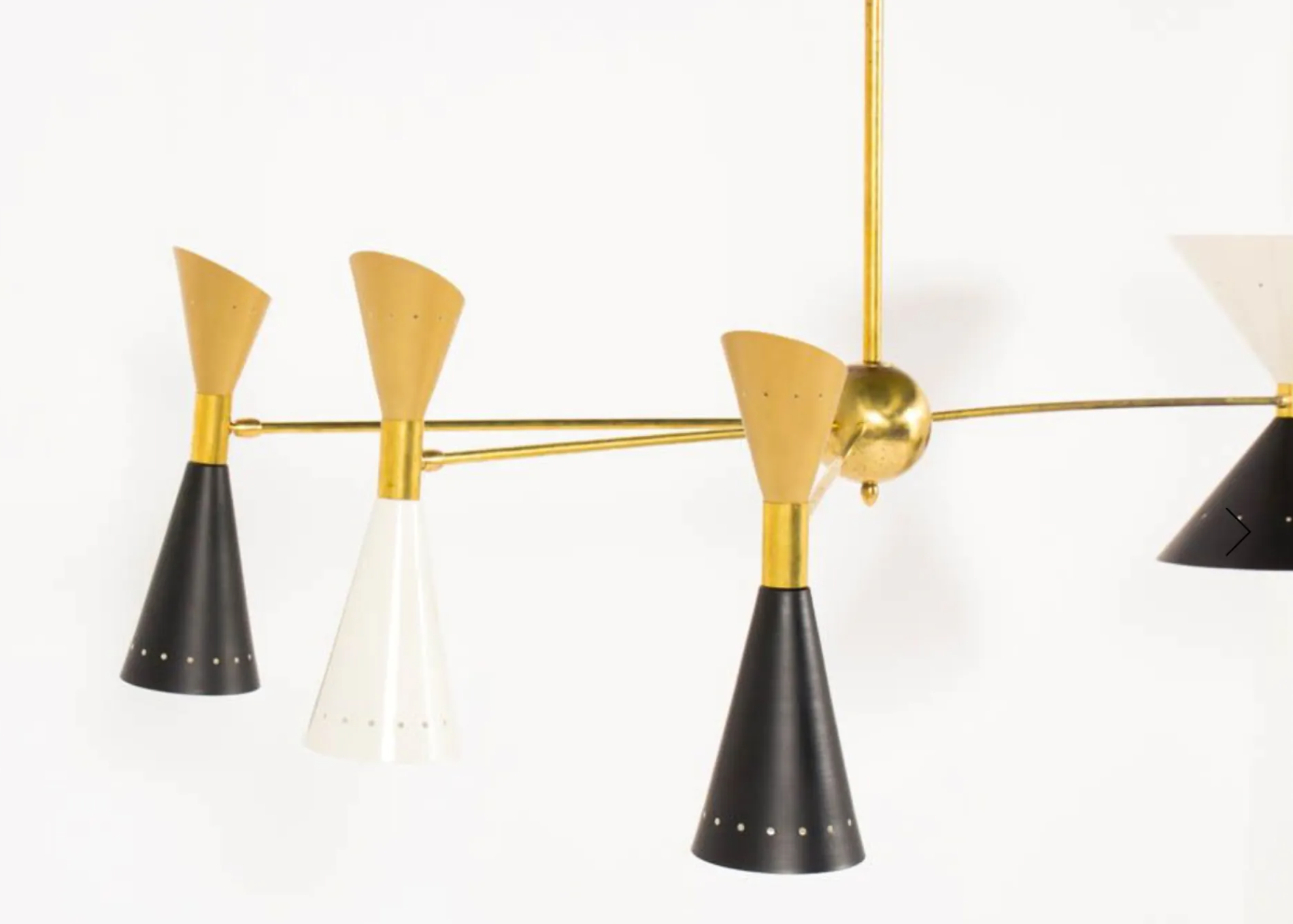 8-light brass chandelier and white-black and gold day blinds