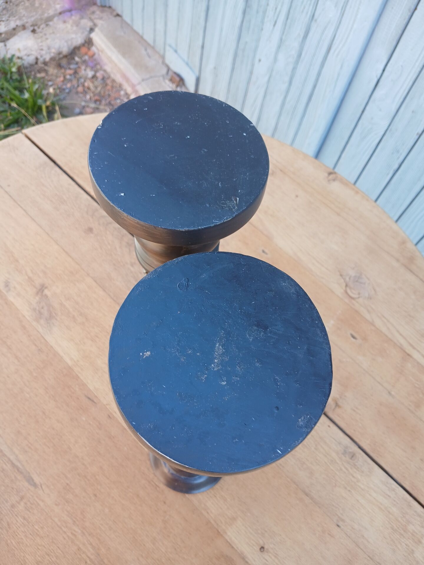 2 carved wooden candlesticks