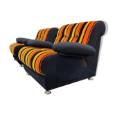 Set of 2 vintage orange and black space age armchairs.