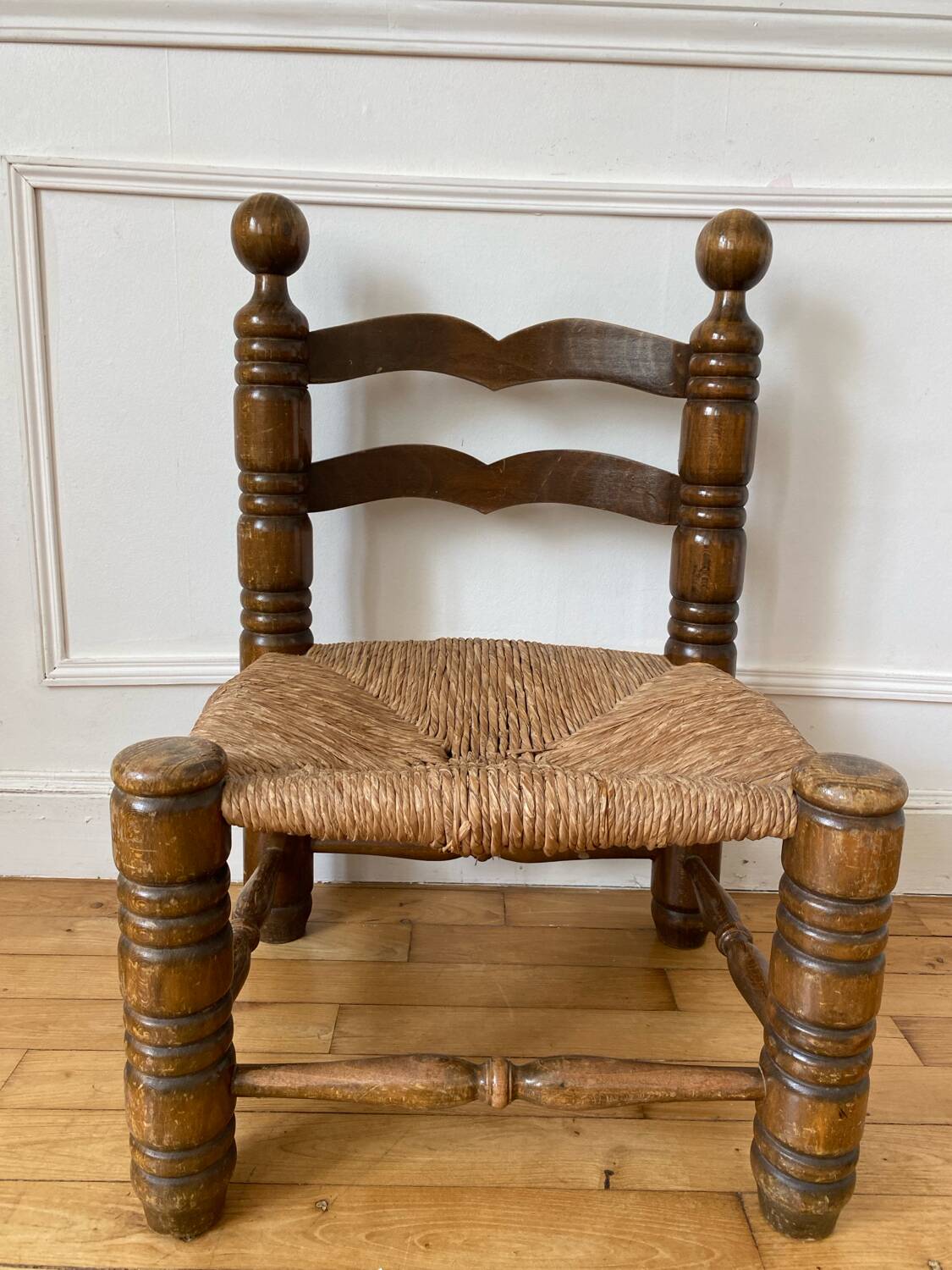 Low fireplace chair in the style of Charles Dudouyt