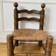 Low fireplace chair in the style of Charles Dudouyt