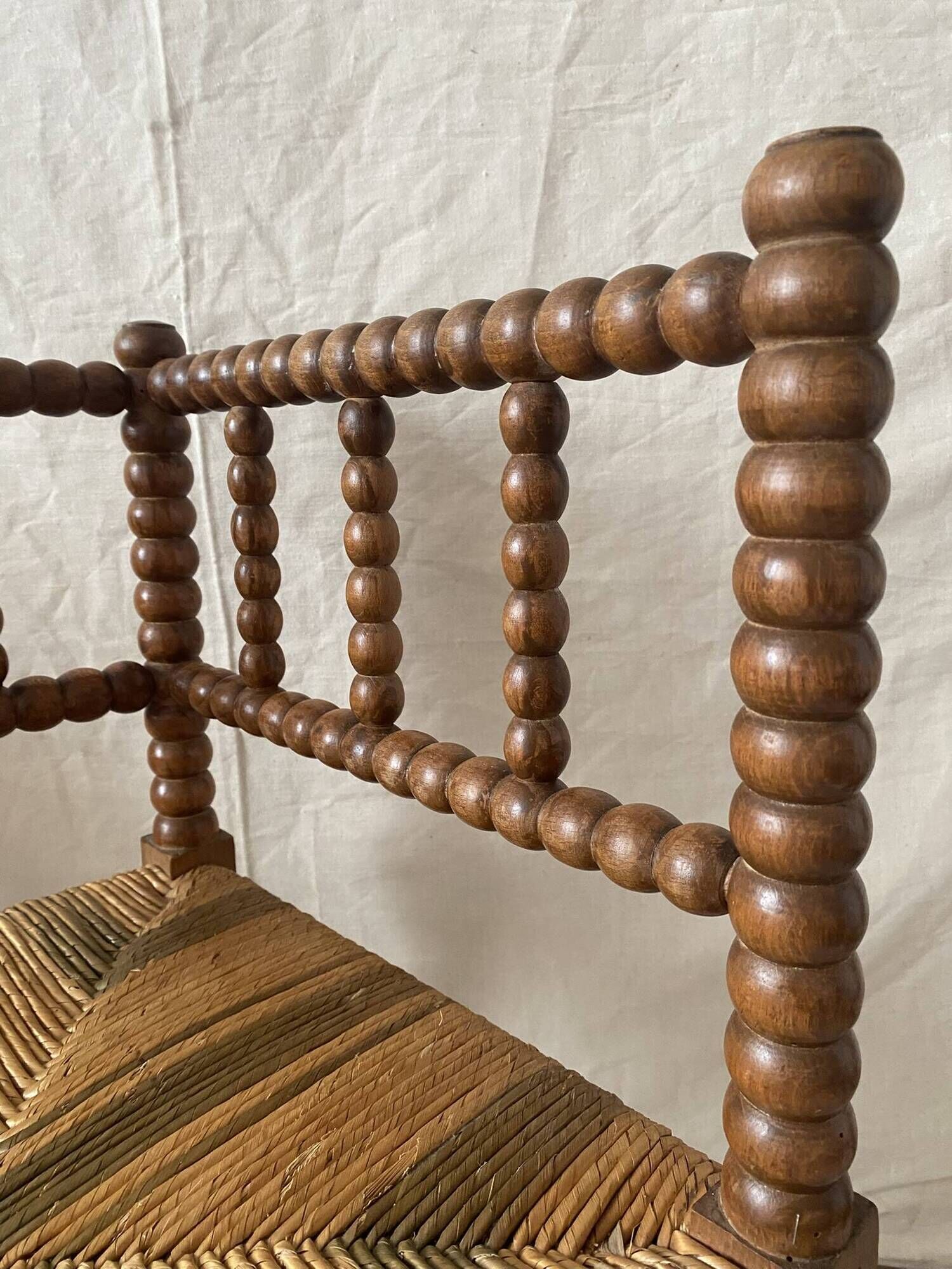 Corner chair in straw and turned wood, fireside chair.