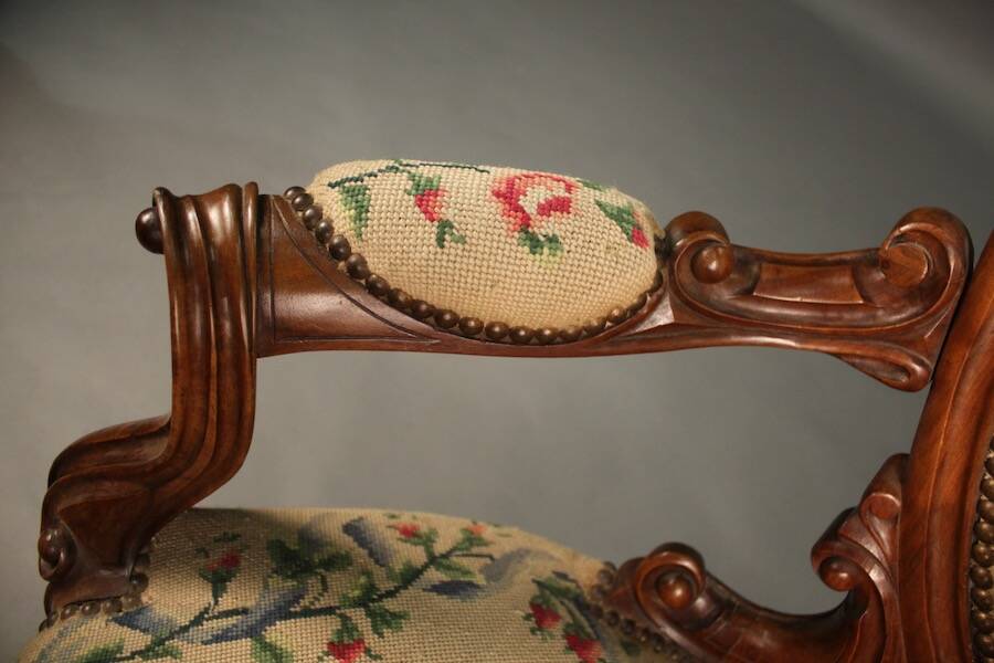 Pair of Louis Philippe armchairs with petit point upholstery.