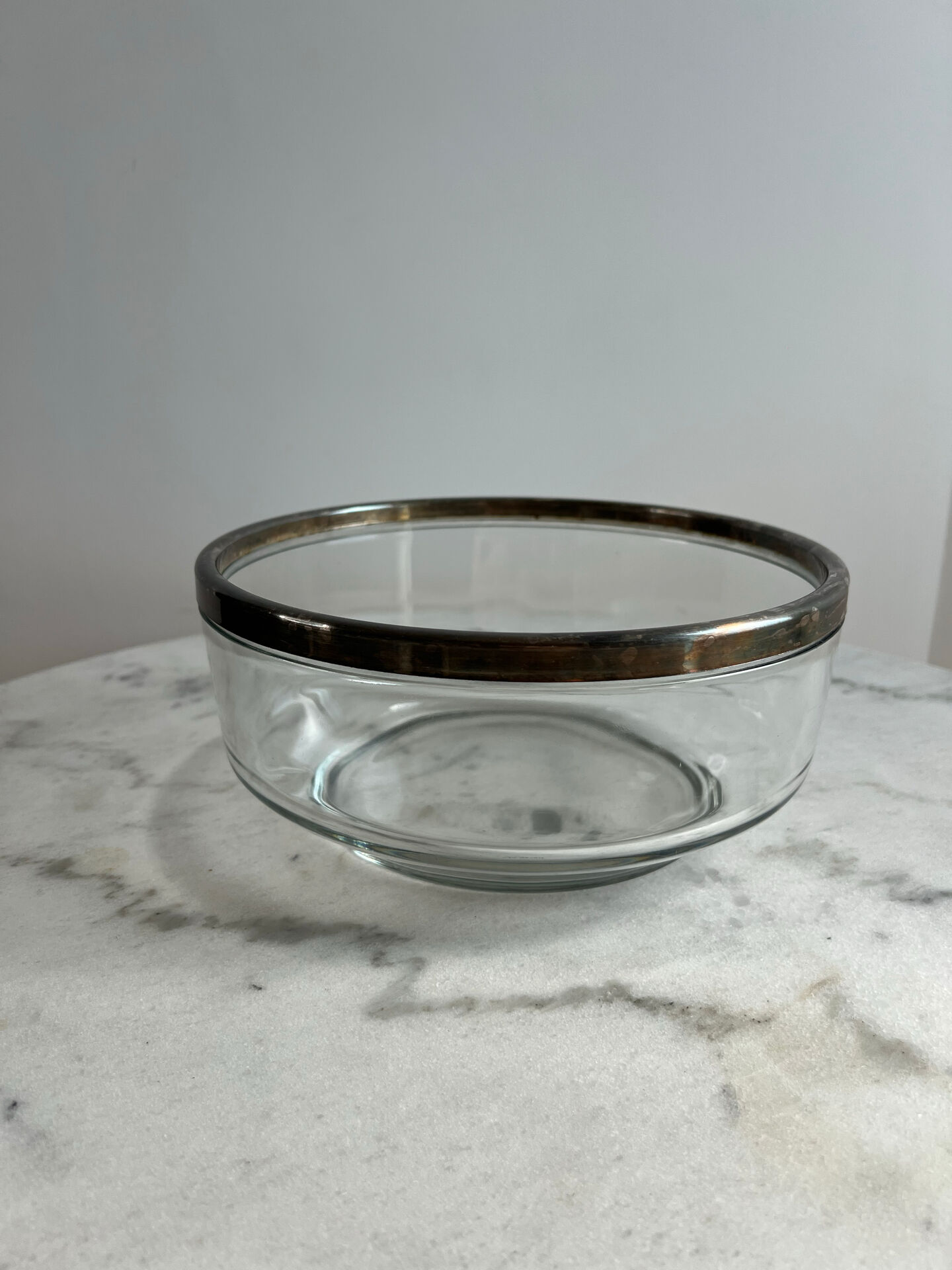 Glass and silver-plated metal salad bowl, silver rim.