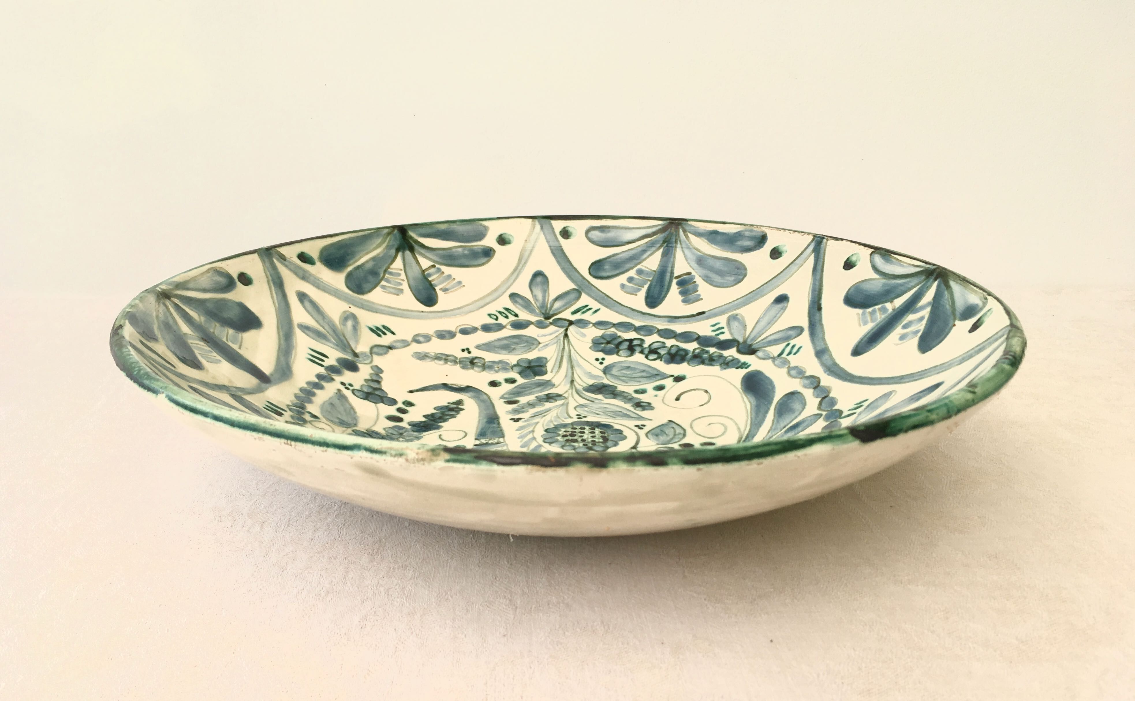 Large ceramic fruit cup with blue peacock