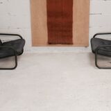 Pair of Prisunic edition armchairs, tubular steel and foam cushions, France, 1973