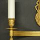 Large pair of wall sconces with winged caryatids in Empire style - gilded bronze