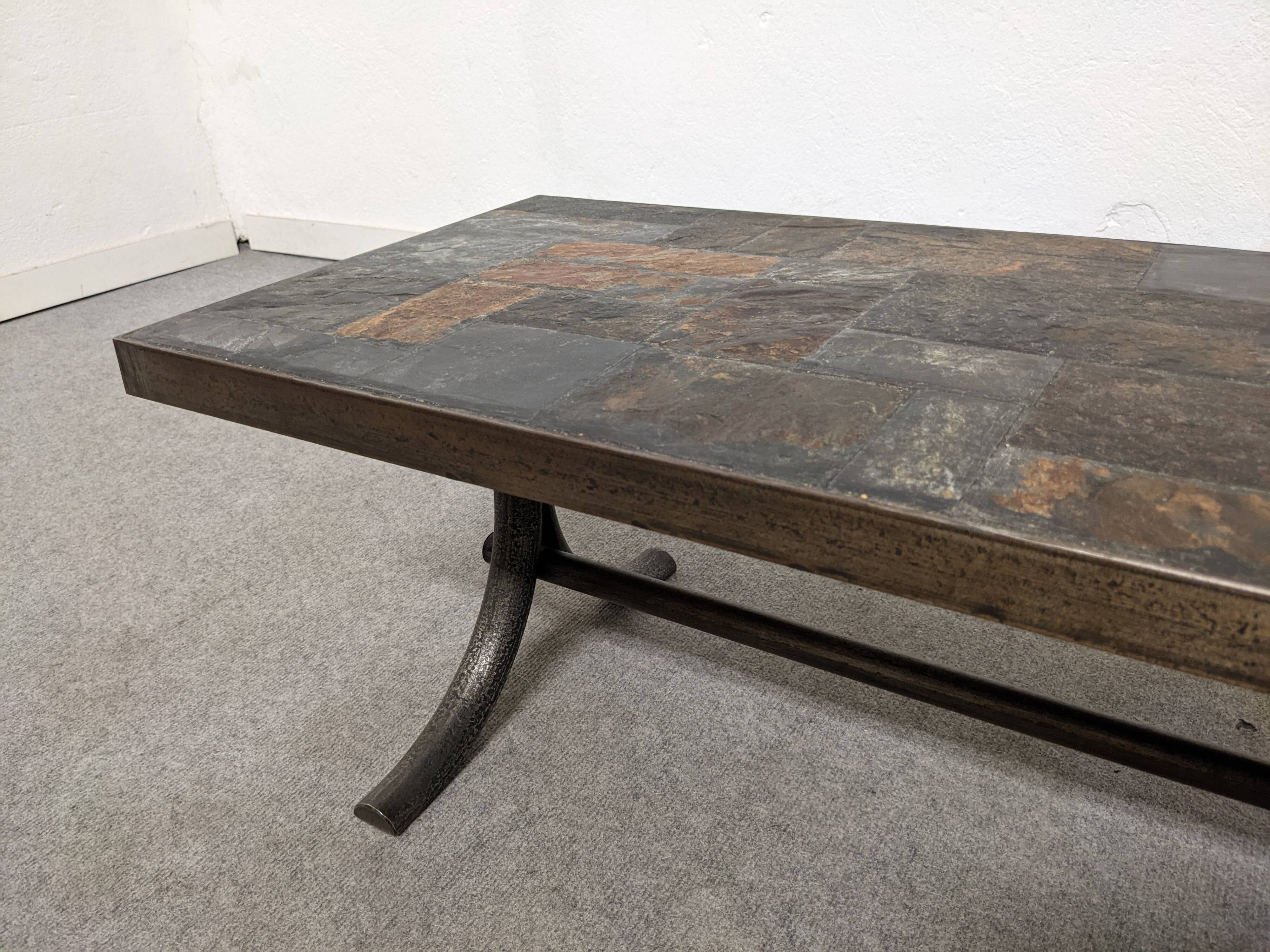 Brutalist coffee table in natural stone and wrought iron, France circa 1960.