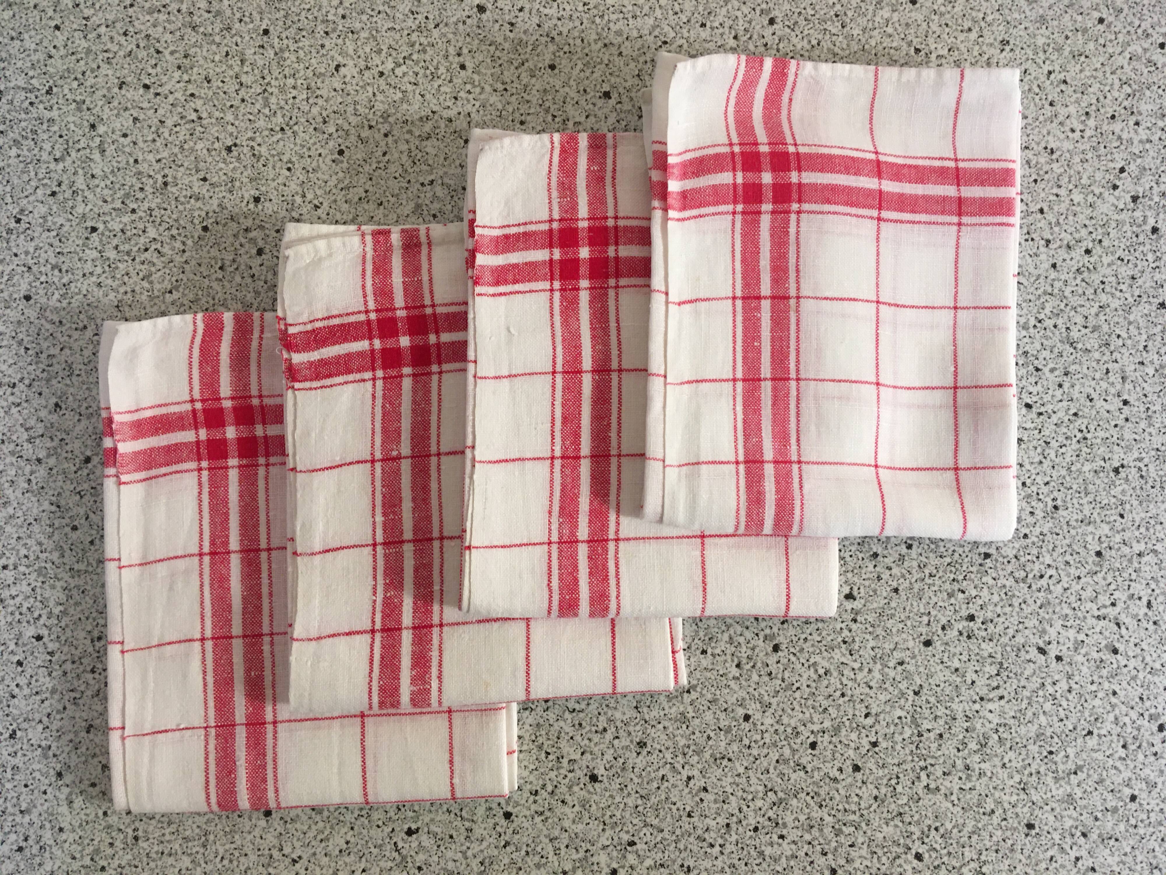 4 red mixed-race tea towels