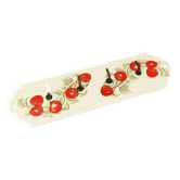 Vintage wall-mounted tea towel holder in enamelled sheet metal with cherry decoration.