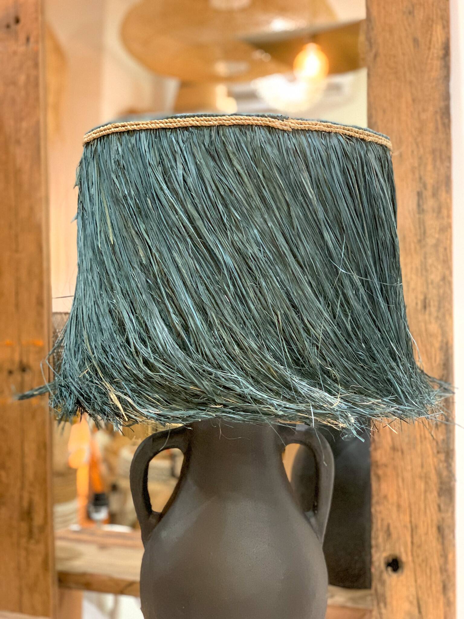 Black terracotta lamp and blue raffia lampshade