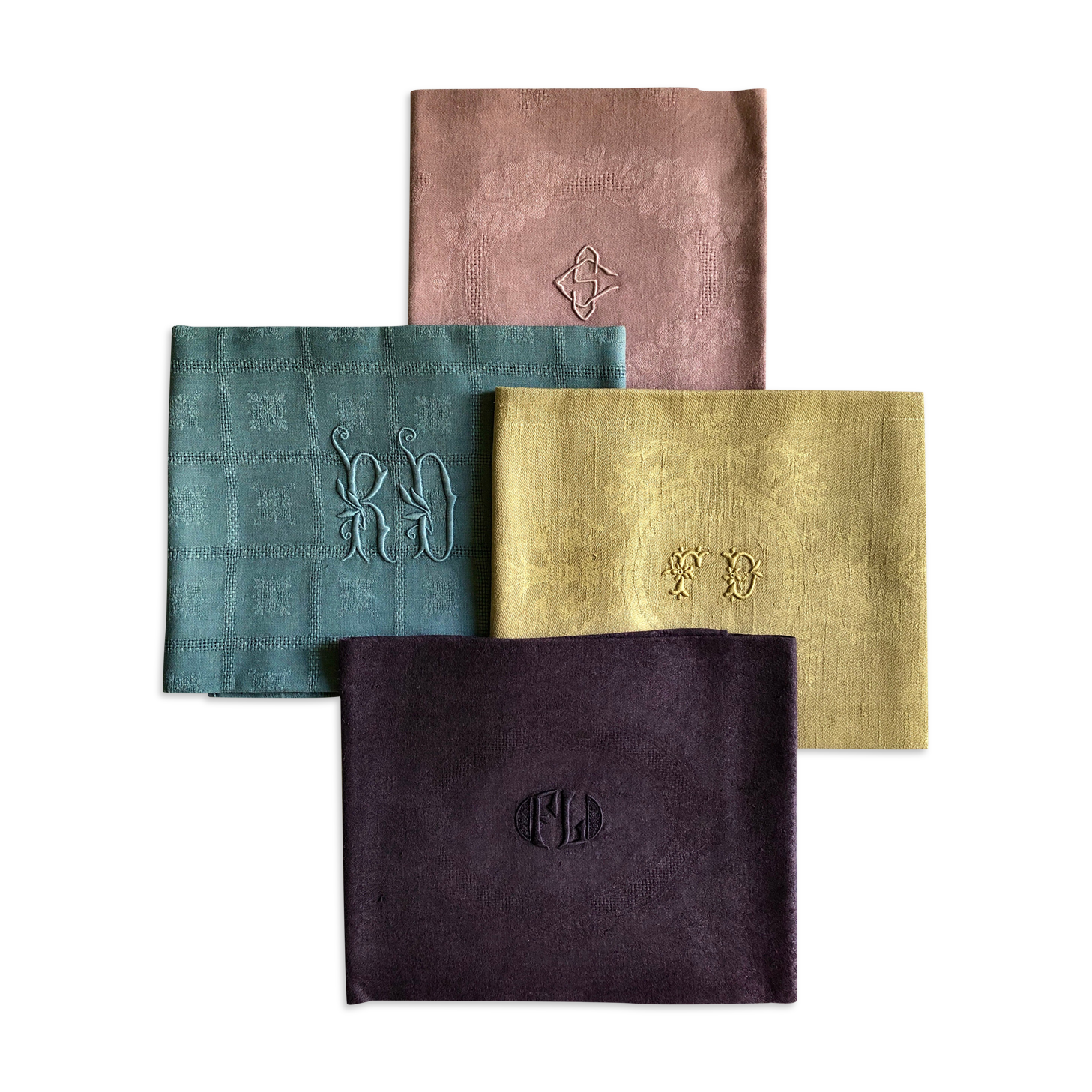 Suite of four tinted antique napkins