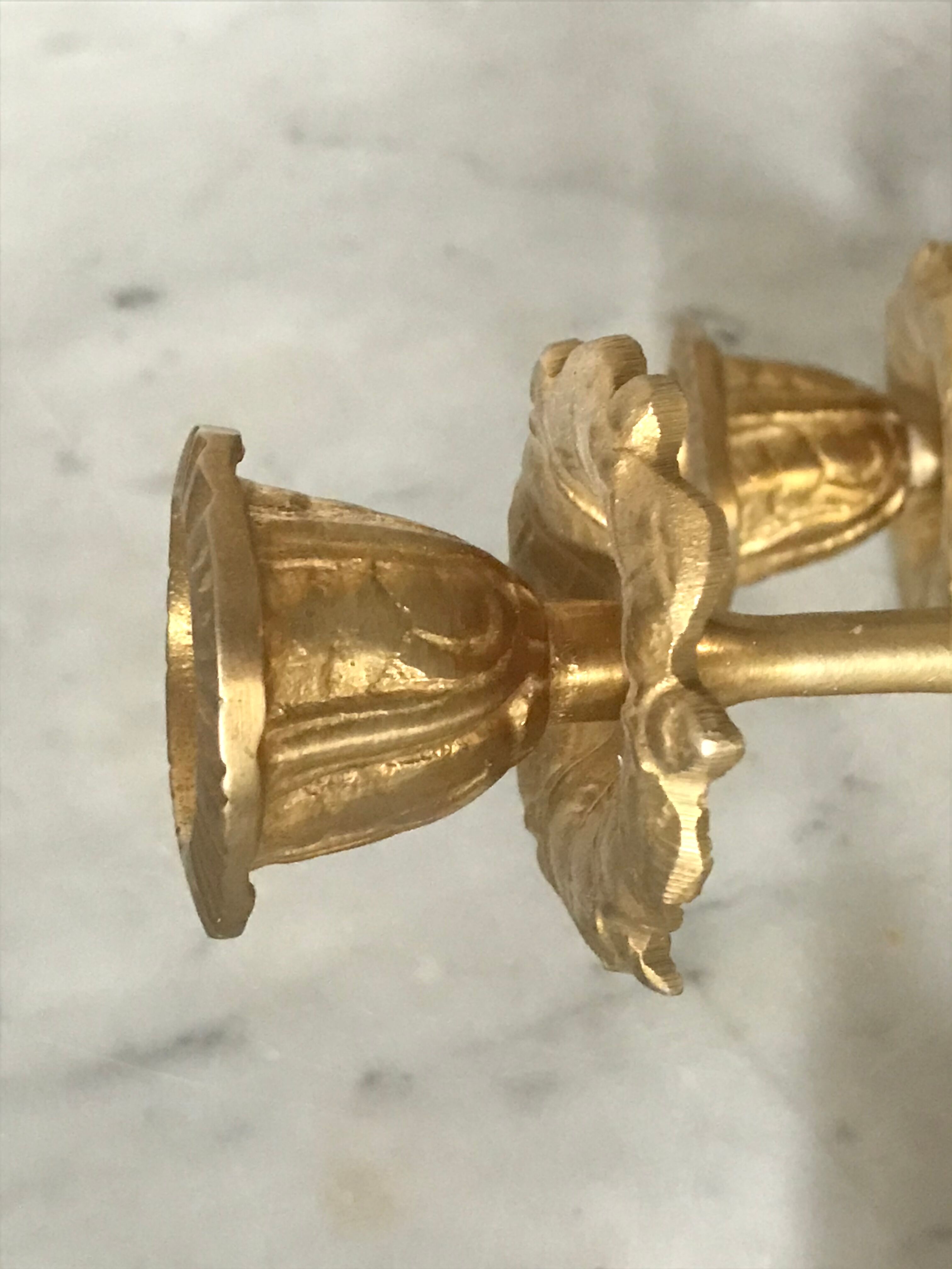 Pair of golden brass candlesticks