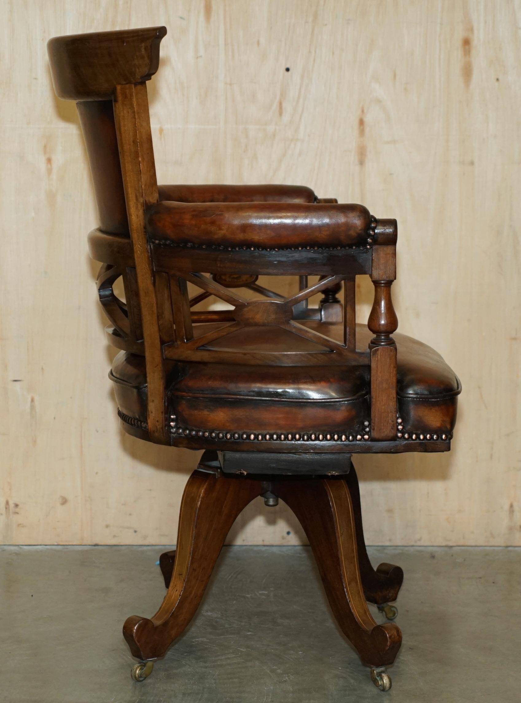 Victorian captain's chair in leather restored by Cornelius V Smith.
