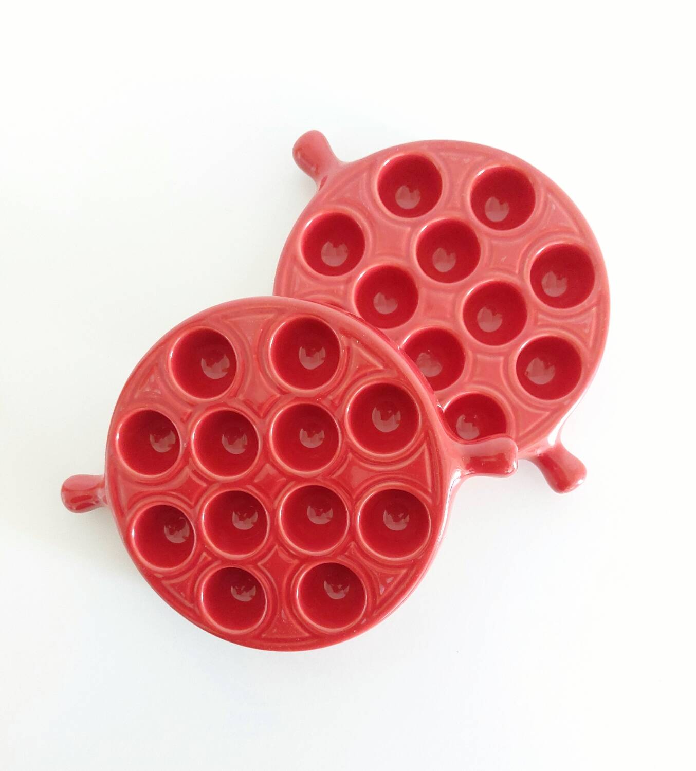 Red ceramic snail dishes