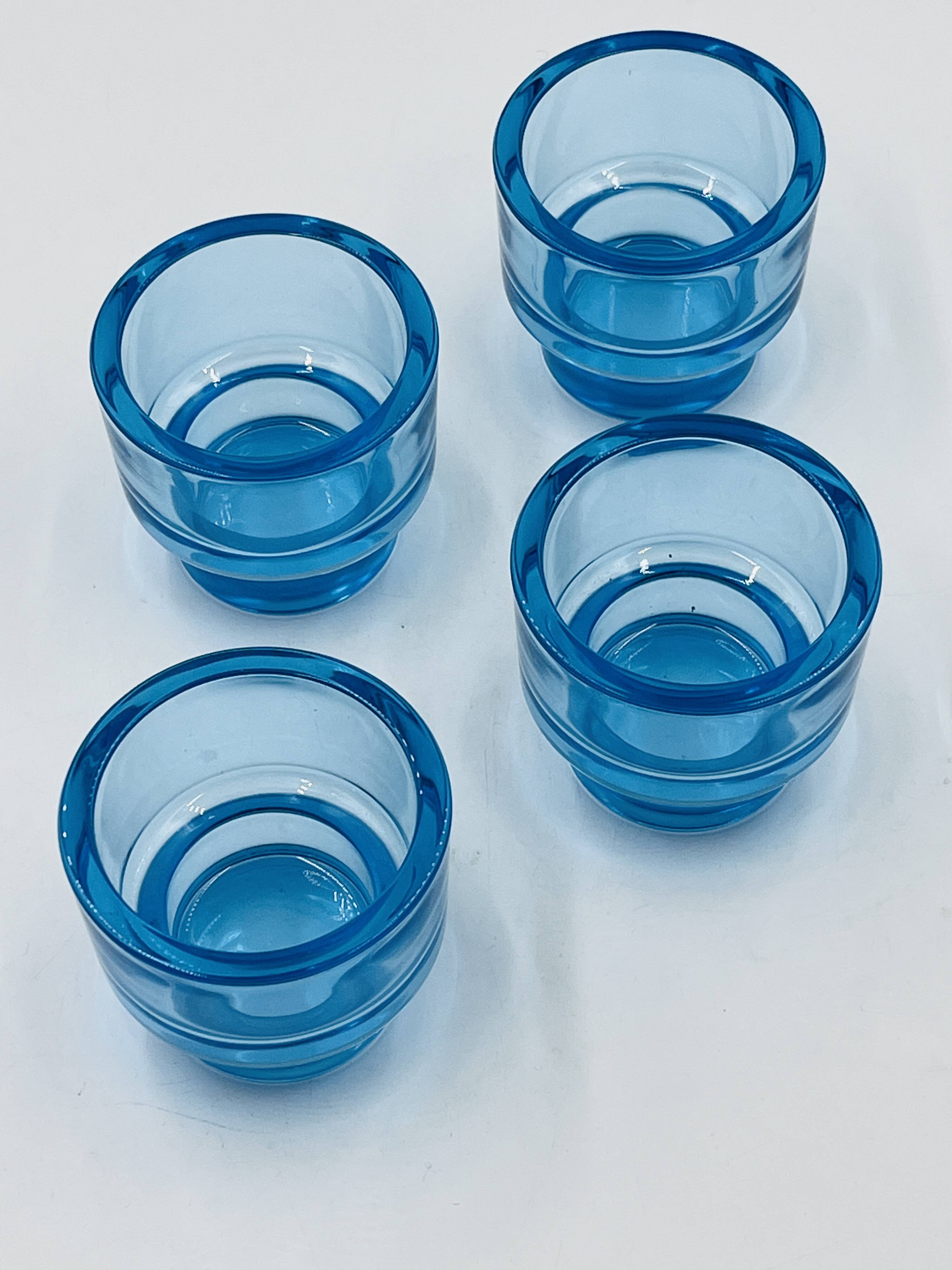 Set of 4 IKEA turquoise aquamarine glass candle holders.