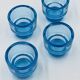 Set of 4 IKEA turquoise aquamarine glass candle holders.