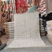 Large Moroccan Berber rug in cream wool with graphic patterns 300 x 200 cm.