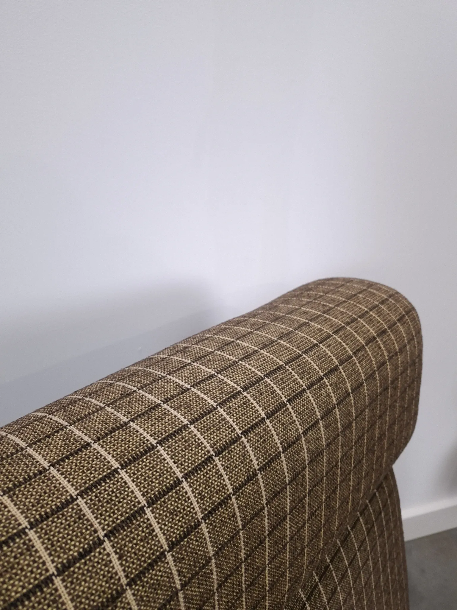 Vintage pull-out sofa bed, brown checked lounge chair with chrome.
