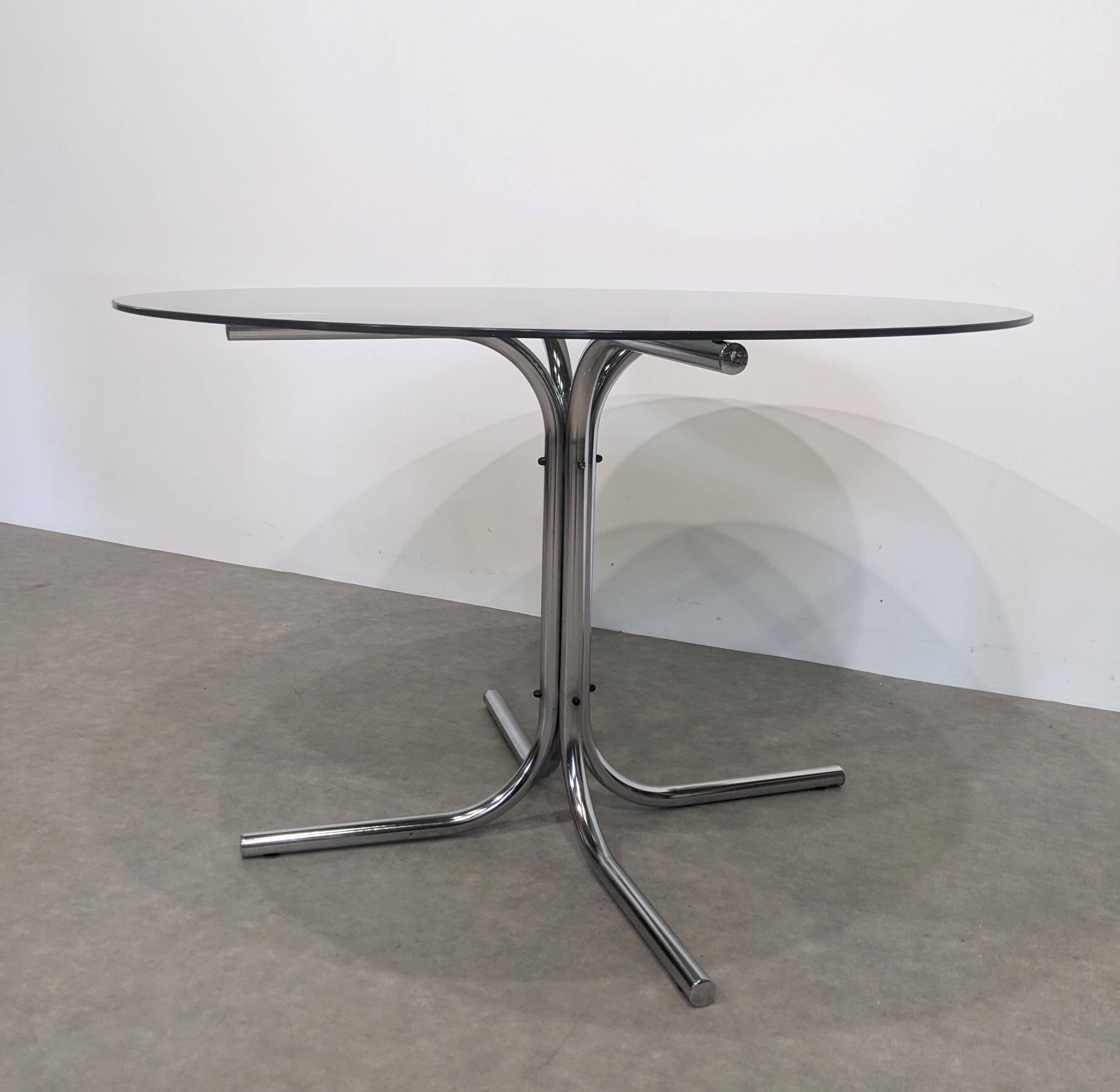 70s round table with smoked glass and chrome